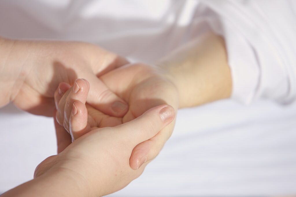 Therapist treating patient's hand