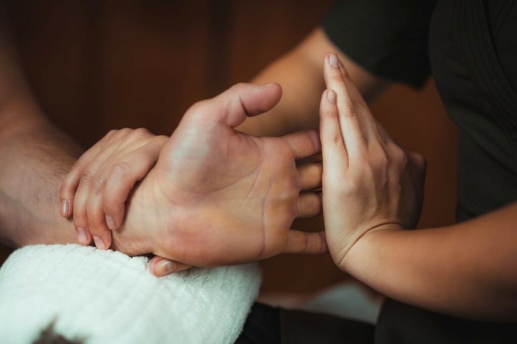 Therapist working with trigger finger patient