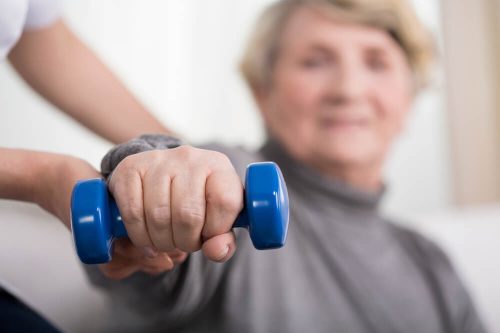 elderly-woman-hand-weight-therapy